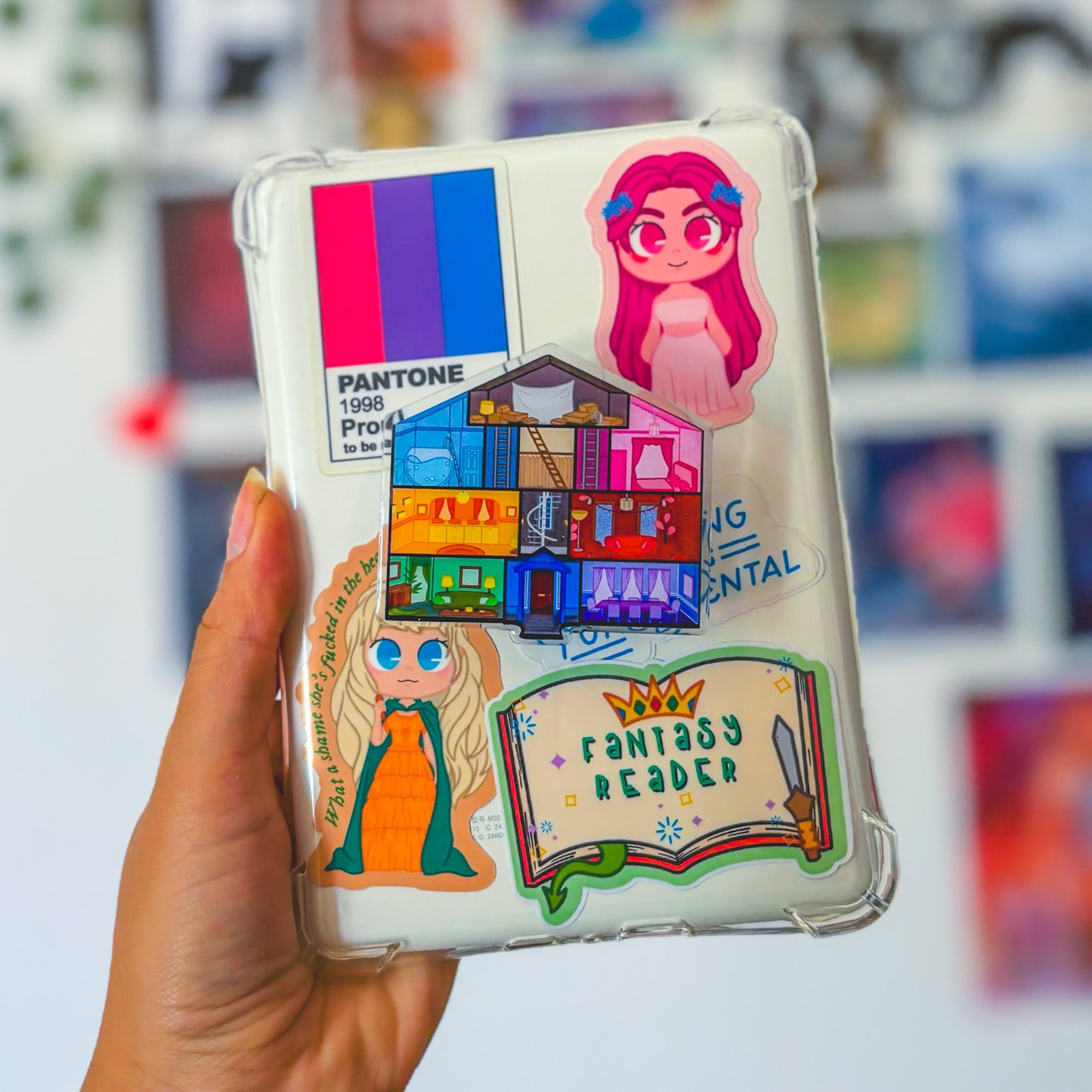 A pastel device grip with Taylor Swift’s Lover House design, showcasing vibrant colors and whimsical illustrations.