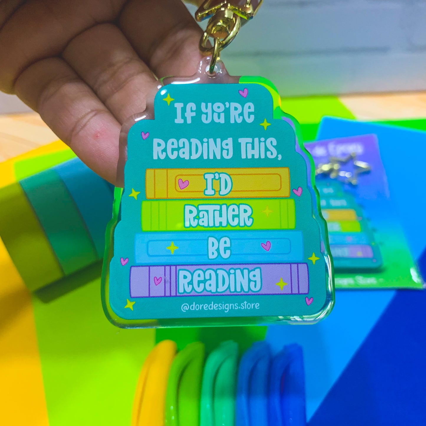 A keychain with a bold, stylish design featuring a witty bookish phrase for literary enthusiasts.