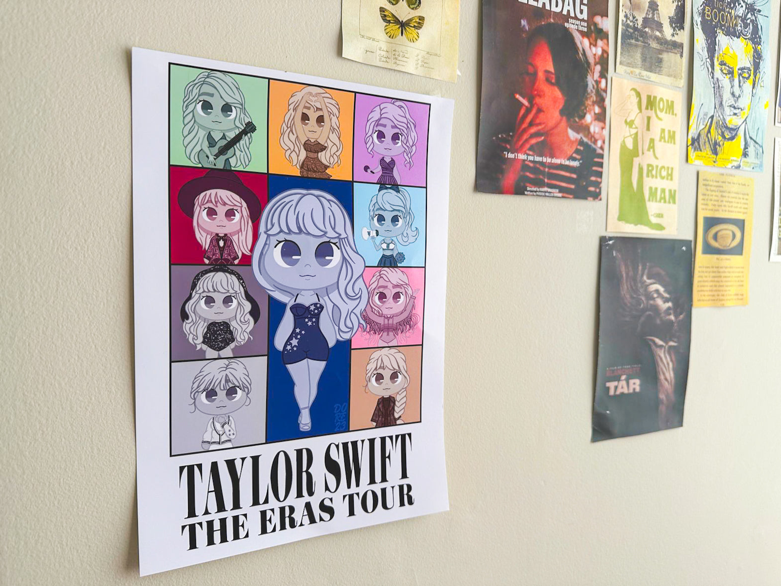 A print showcasing designs inspired by Taylor Swift’s eras, with elements from her albums and iconic looks.