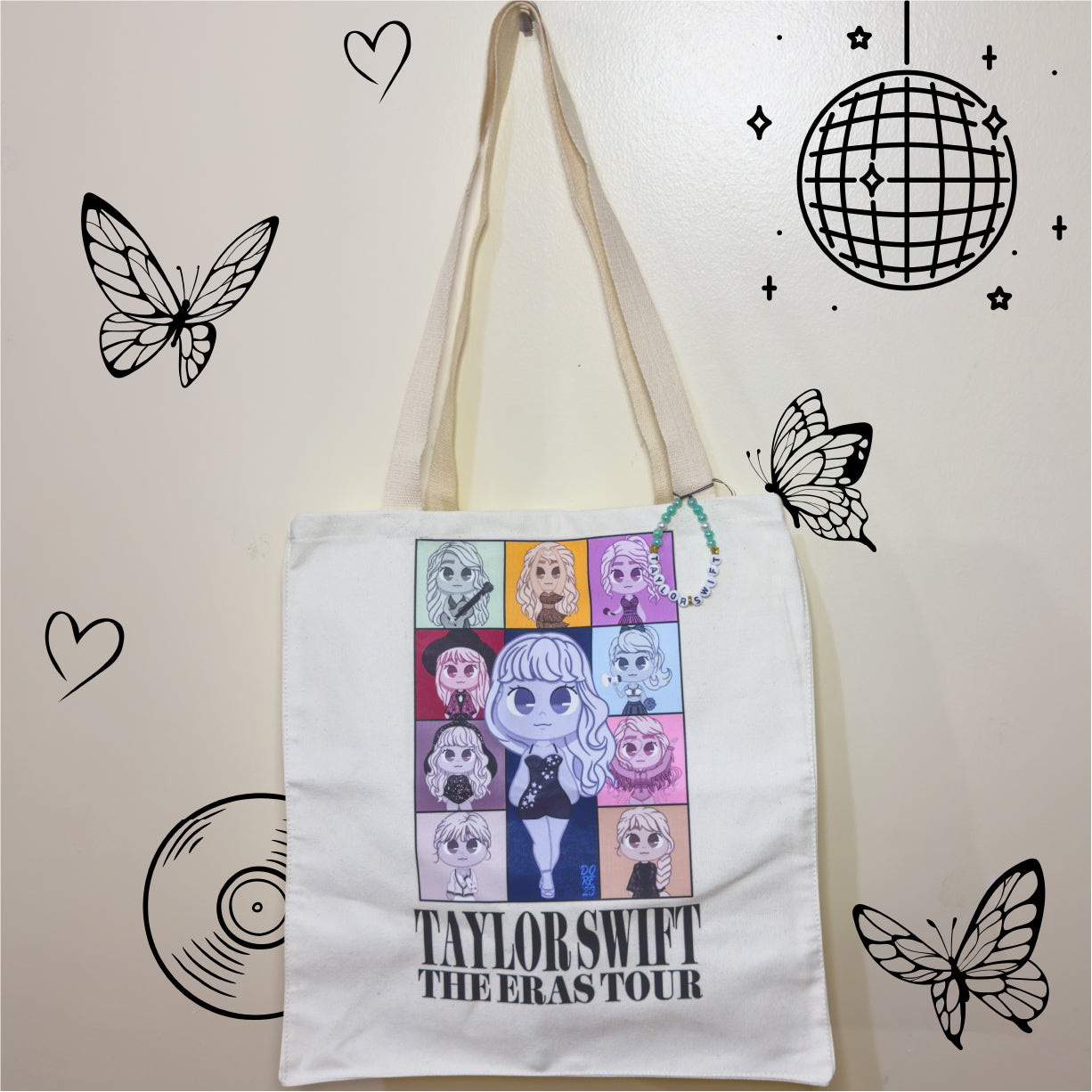 A stylish canvas tote bag inspired by Taylor Swift's Eras Tour, featuring a vibrant chibi design that celebrates her iconic musical eras.