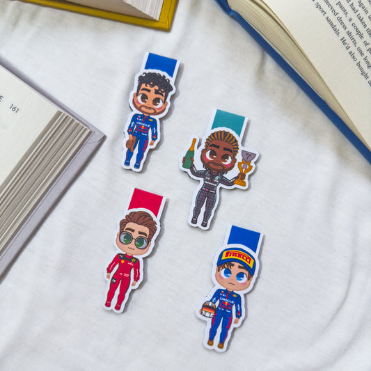 Magnetic bookmarks inspired by Formula 1, showcasing drivers, race cars, and checkered flags in sleek, sporty designs.